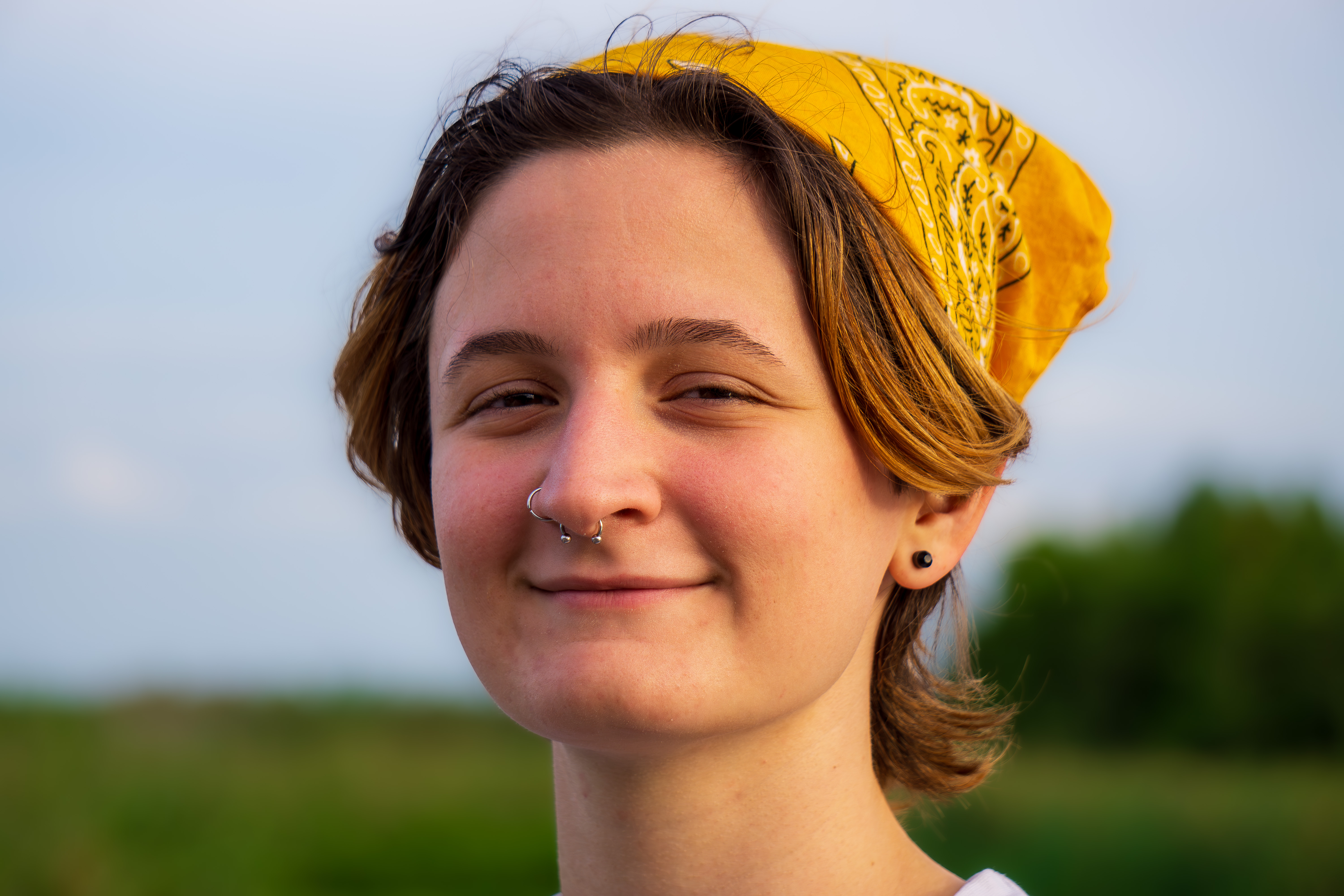 Photograph of a person in a yellow bandana