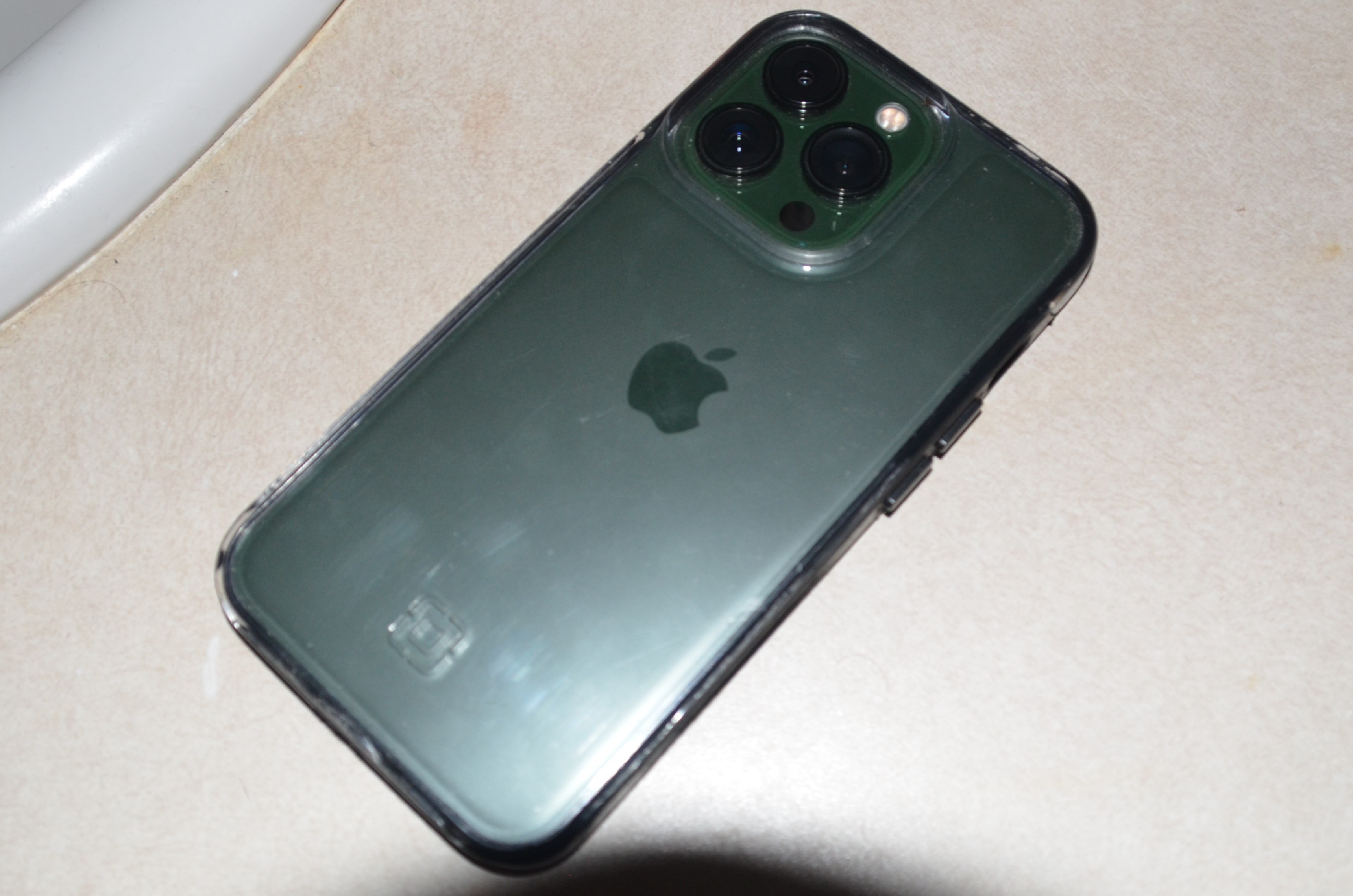 A photograph of a green iPhone